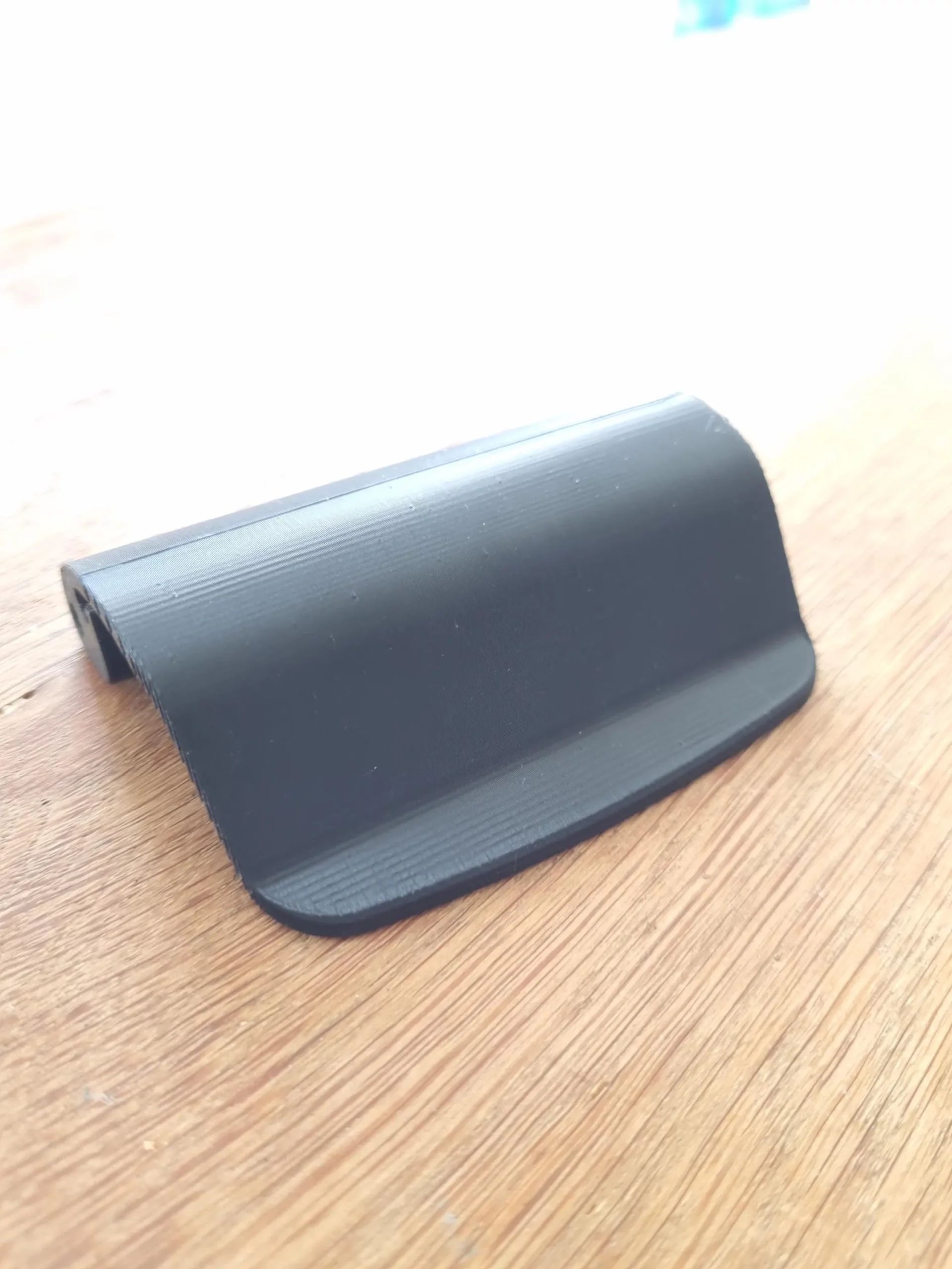 Close-up of the 3D-printed PETG recline handle replacement part