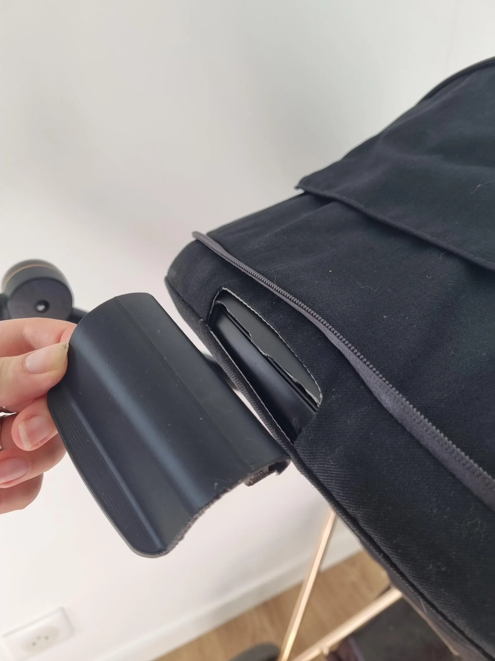 Cybex stroller with the recline handle removed, showing where the replacement part fits